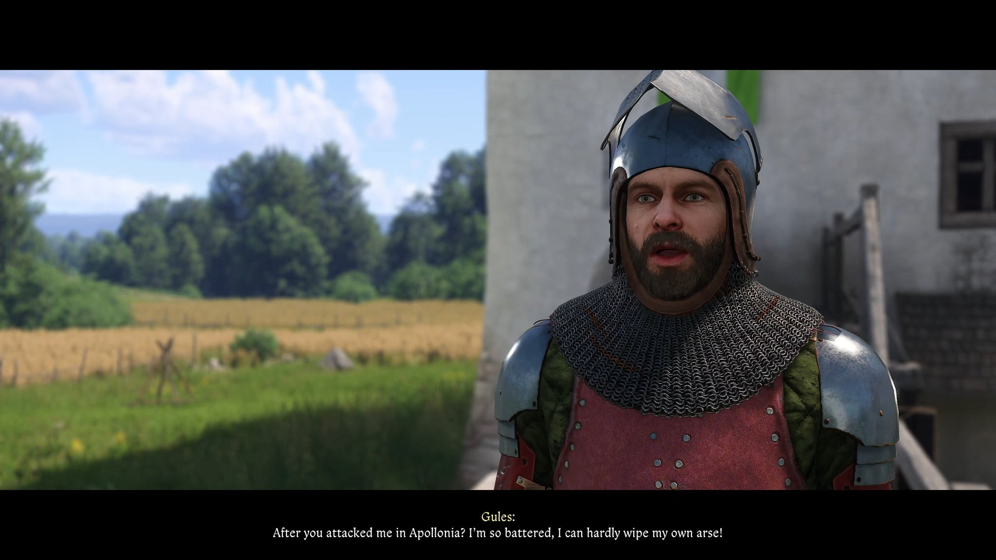 Крупный план Рудого, NPC и бывшего бандита в Kingdom Come: Deliverance 2, в доспехах во время разговора с игроком.
